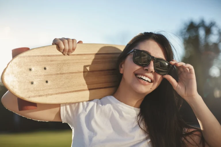 young women practicing skateboard as a summer sport